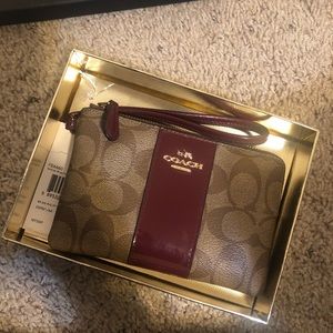 COACH Signature Canvas Wristlet in Brown with Wine Patent Trim